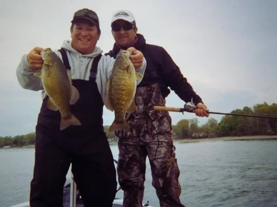 BASSIN' USA founders Brendan and Joe holding a pair of big smallmouth bass caught on Lake Erie.