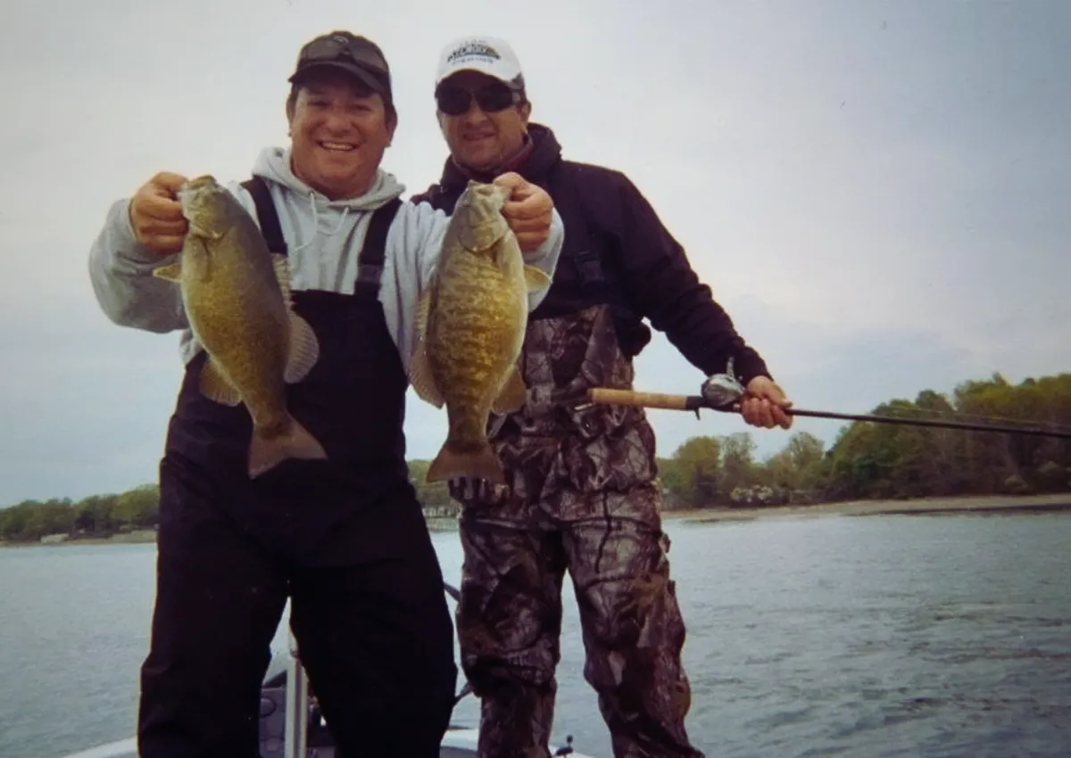 BASSIN' USA founders Brendan and Joe holding a pair of big smallmouth bass caught on Lake Erie.