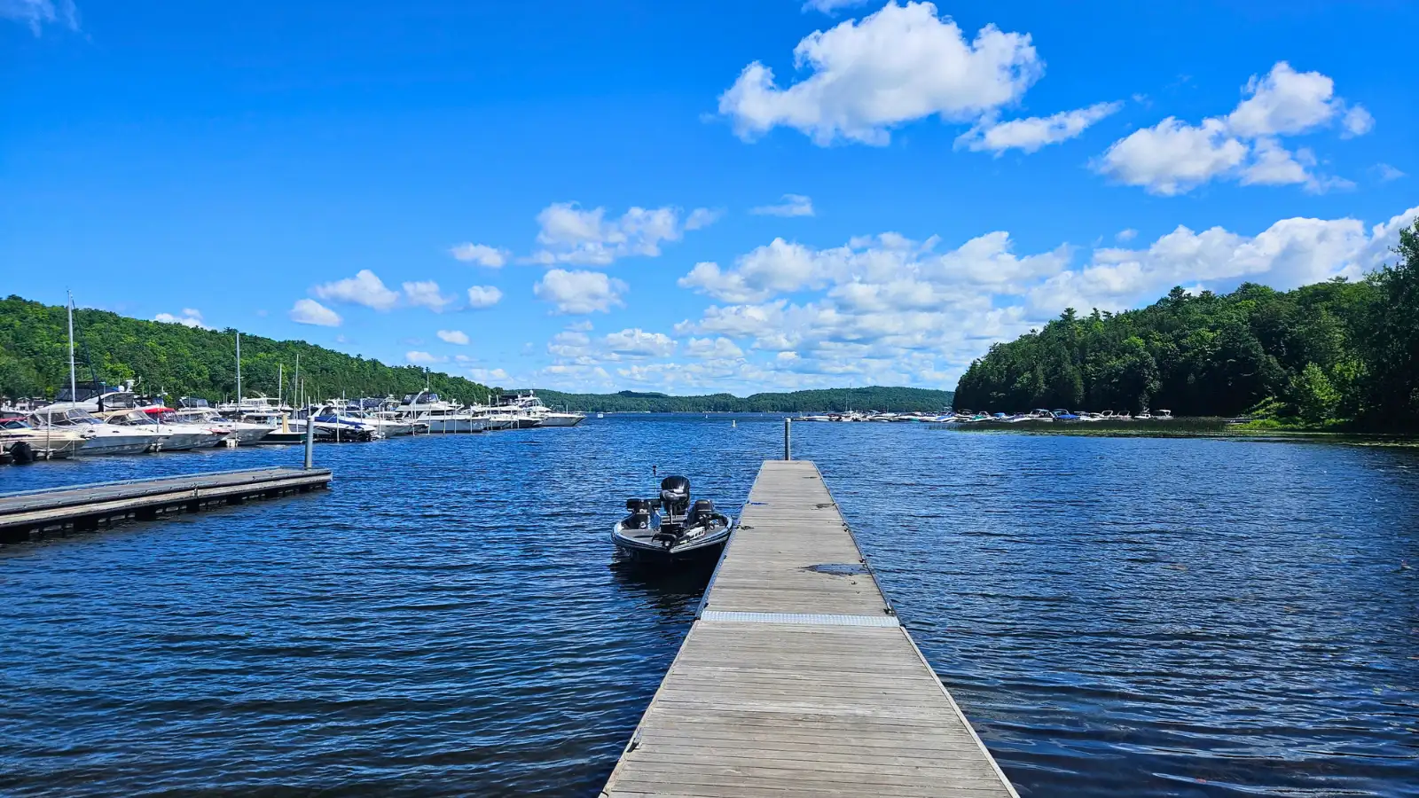 Lake Champlain boat launch and shoreline with fishing water and distant hills