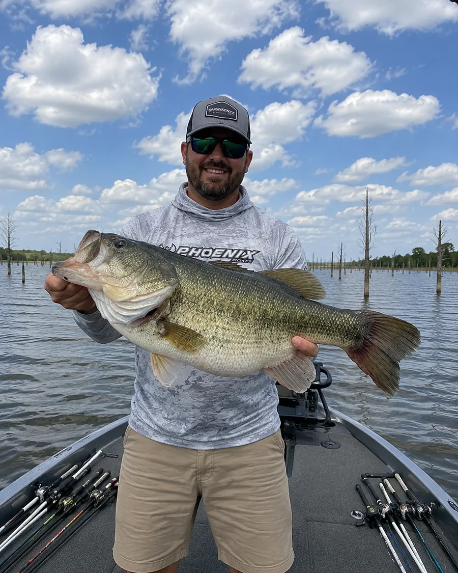 Angler holding a trophy largemouth bass on Lake Fork in Texas